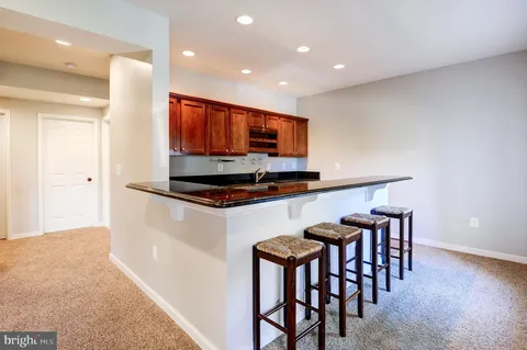 a bedroom with a bed and a mirror