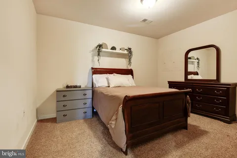 a view of a house with swimming pool and sitting area
