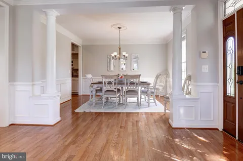a view of a living room with wooden floor