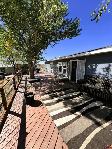 a view of a chairs and tables on the deck