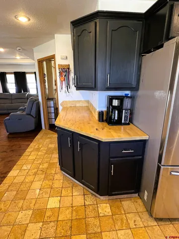 a kitchen with stainless steel appliances a sink stove and cabinets