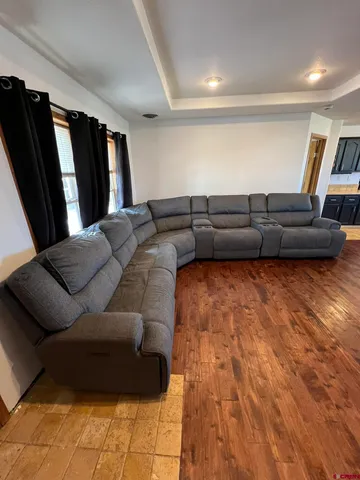 a living room with furniture rug and window
