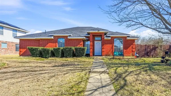 a view of a backyard of the house