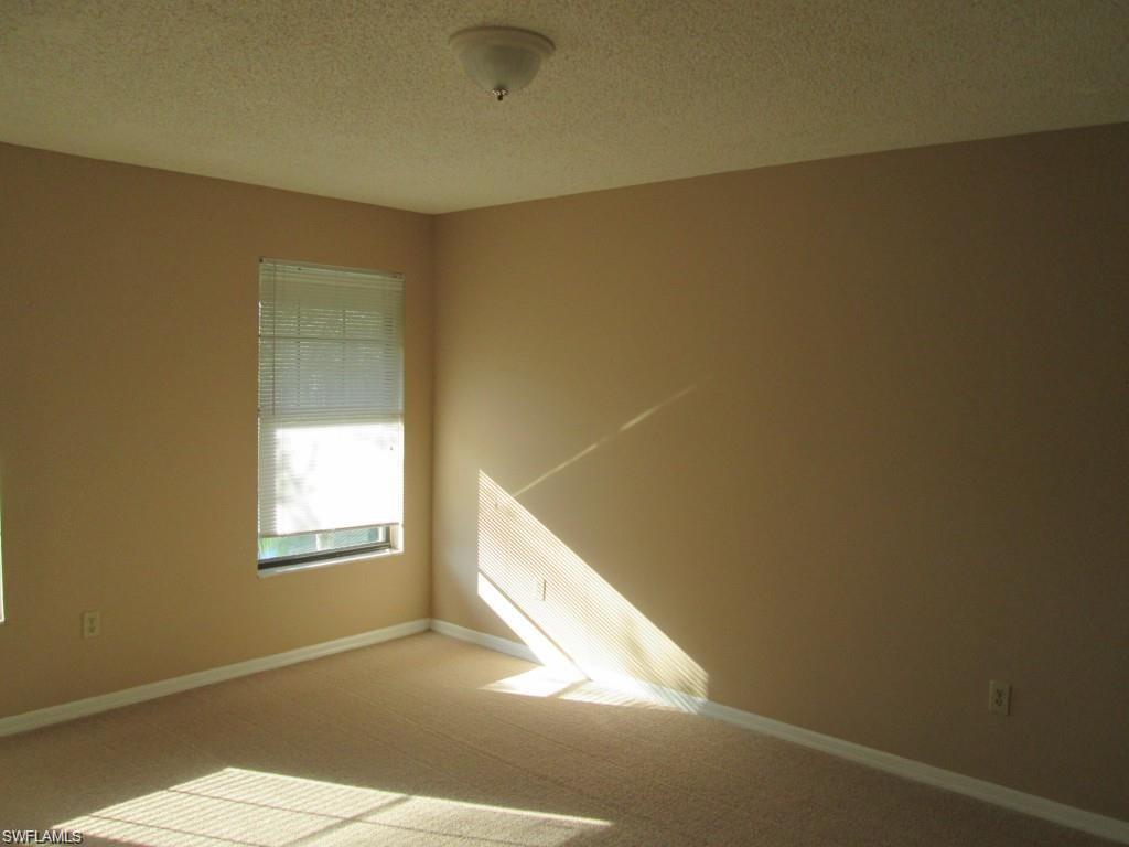 5355 Treetops Drive, Unit S201 Naples, FL 34113 - Photo 5 of 7 a view of a livingroom with a window
