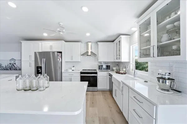 a living room with fireplace furniture and a wooden floor