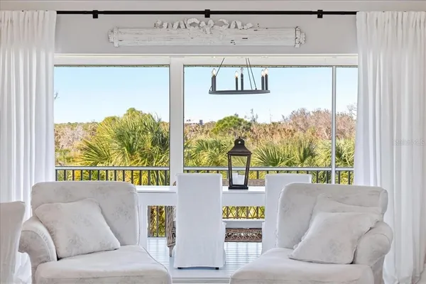 a view of a balcony with furniture