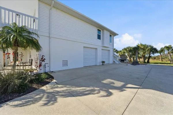a view of a backyard of the house