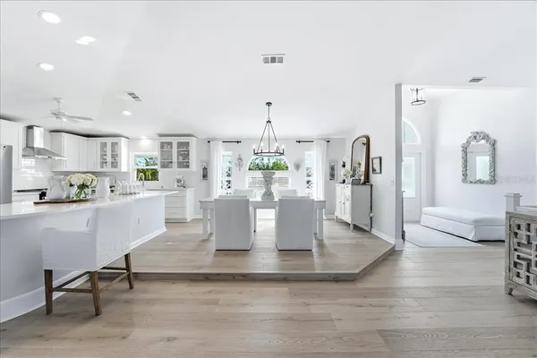 a living room with a table and chairs