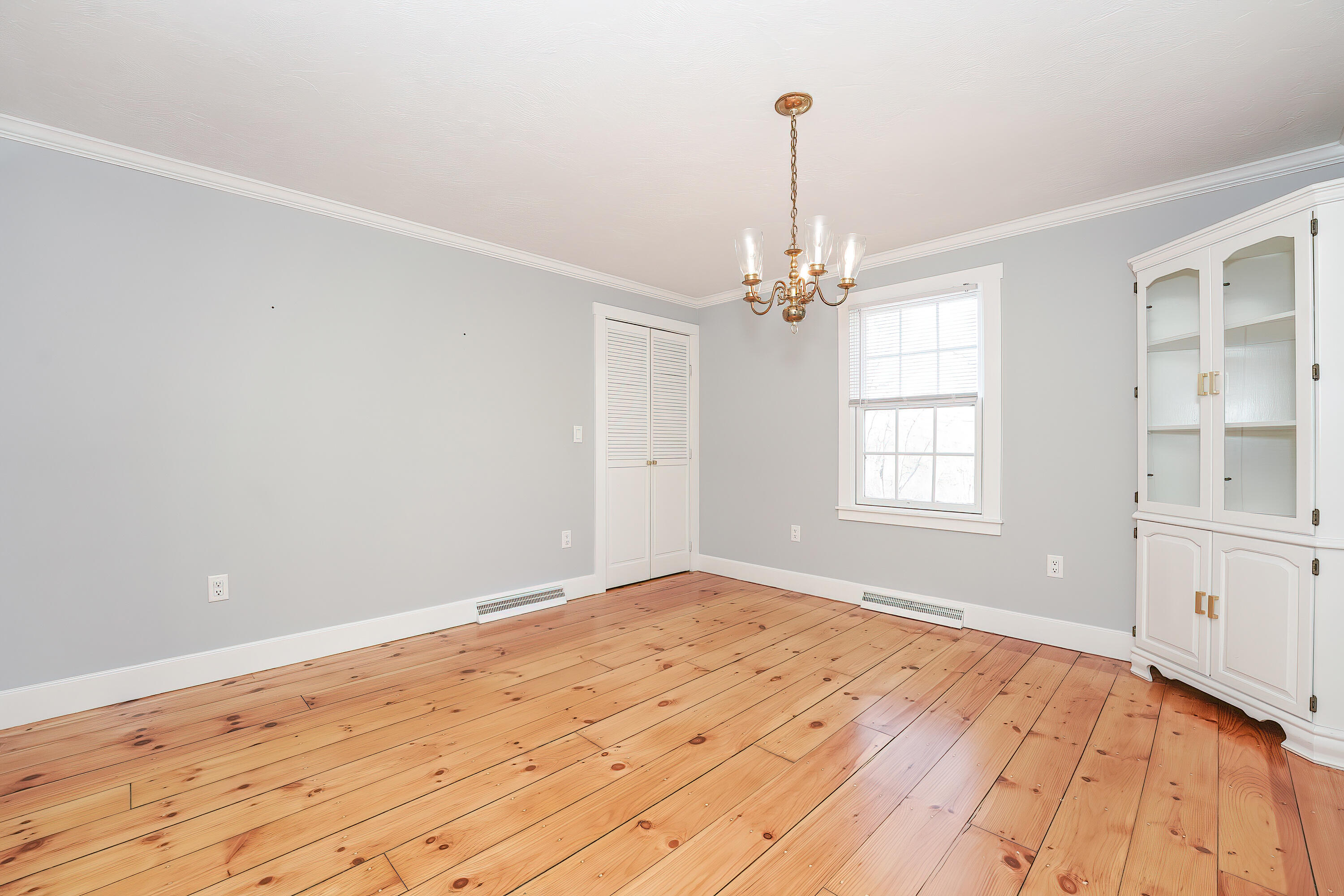240 Oak Street West Barnstable, MA 02668 - Photo 12 of 89 a view of empty room with wooden floor and fan