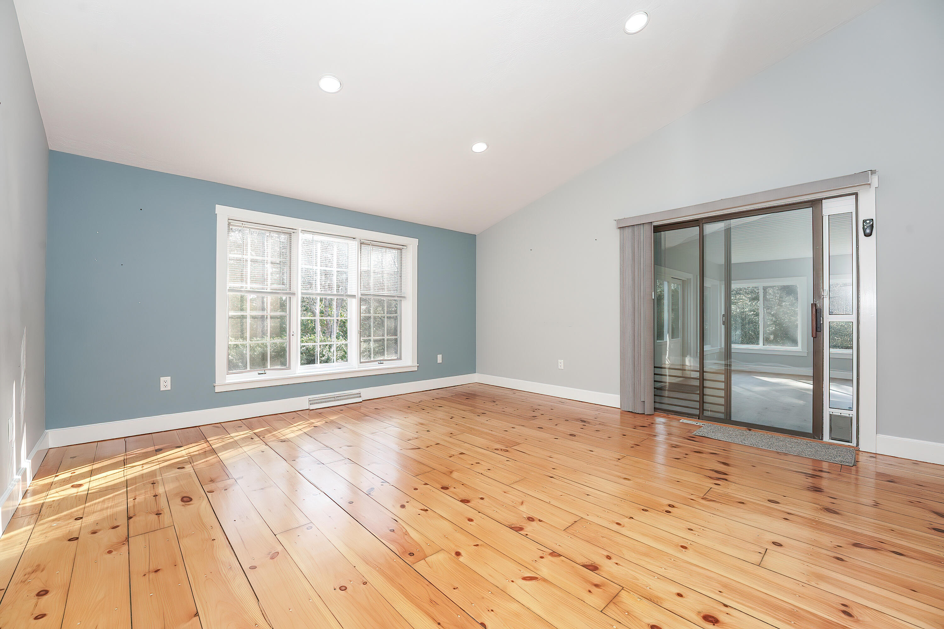 240 Oak Street West Barnstable, MA 02668 - Photo 15 of 89 a view of an empty room with wooden floor and a window