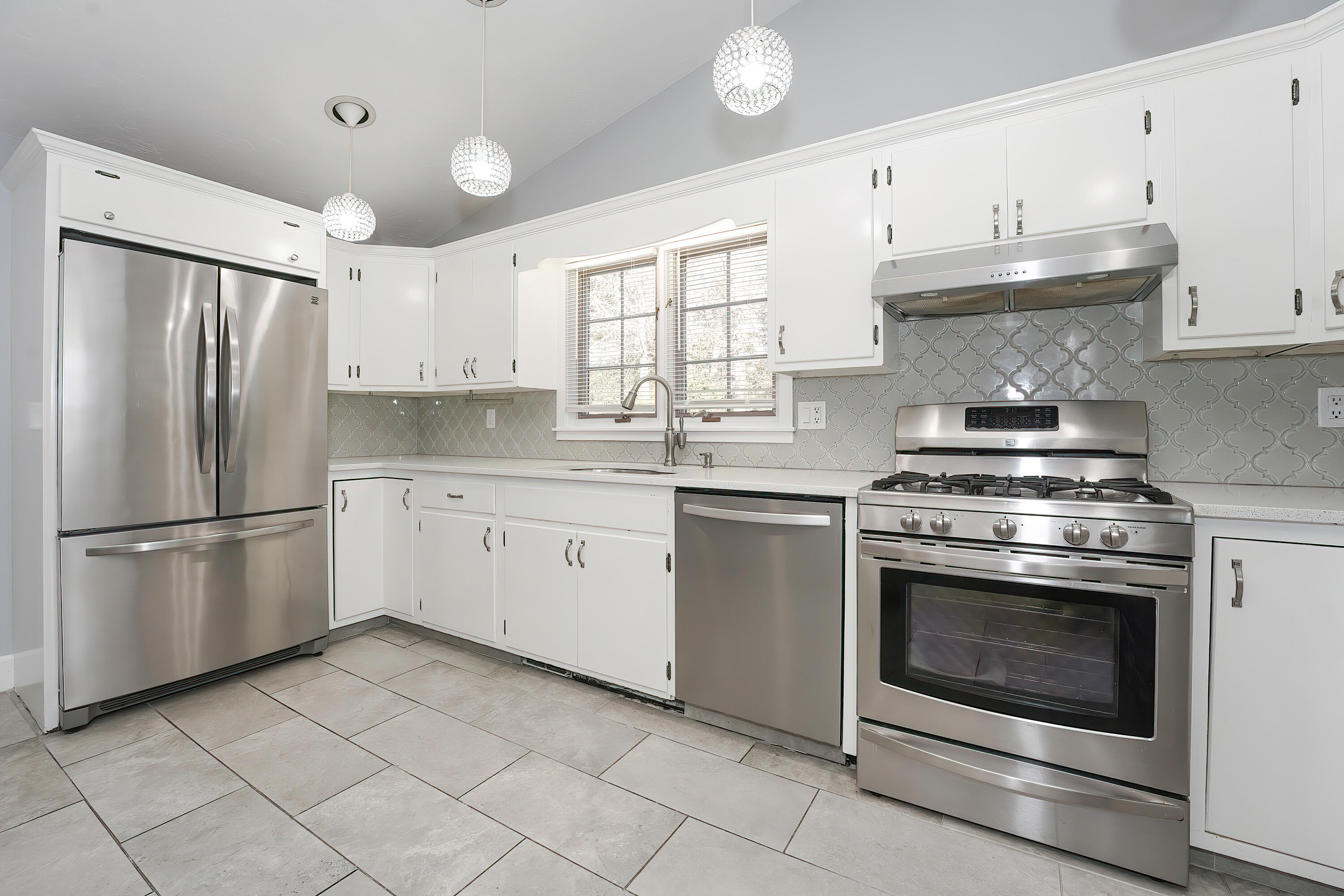 240 Oak Street West Barnstable, MA 02668 - Photo 20 of 89 a kitchen with cabinets stainless steel appliances and a window