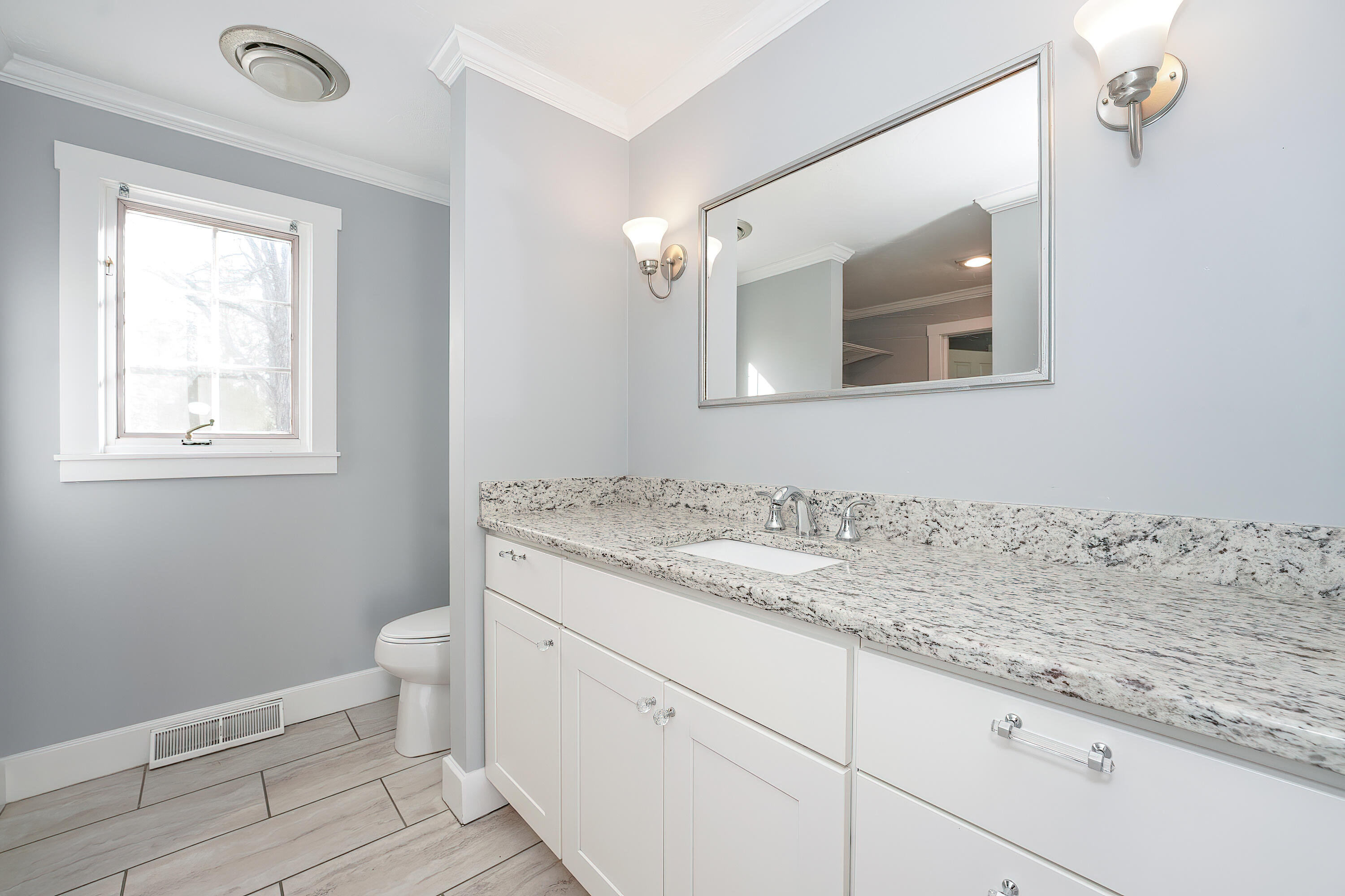 240 Oak Street West Barnstable, MA 02668 - Photo 28 of 89 a bathroom with a granite countertop toilet sink and mirror