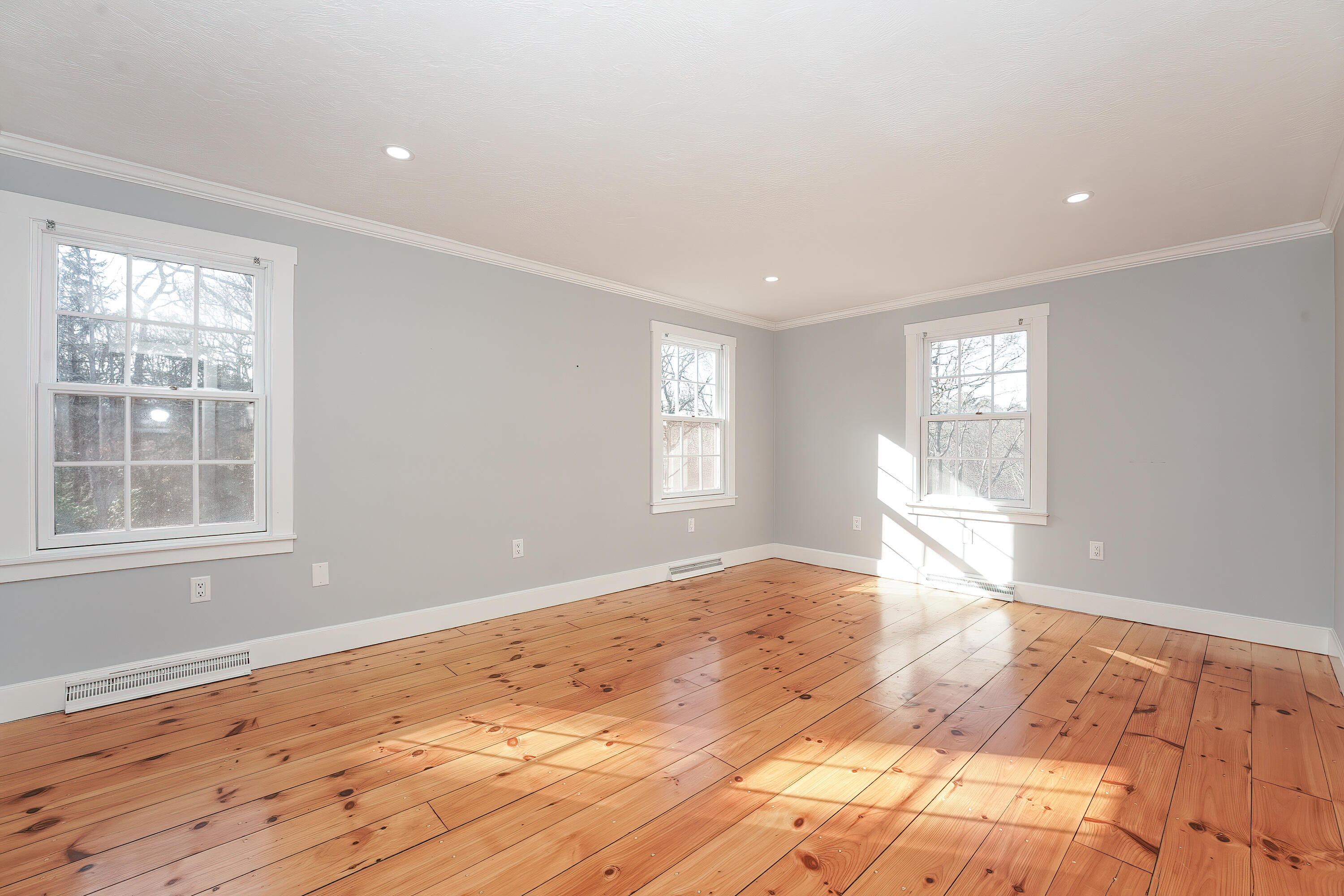240 Oak Street West Barnstable, MA 02668 - Photo 32 of 89 a view of empty room with wooden floor and fan