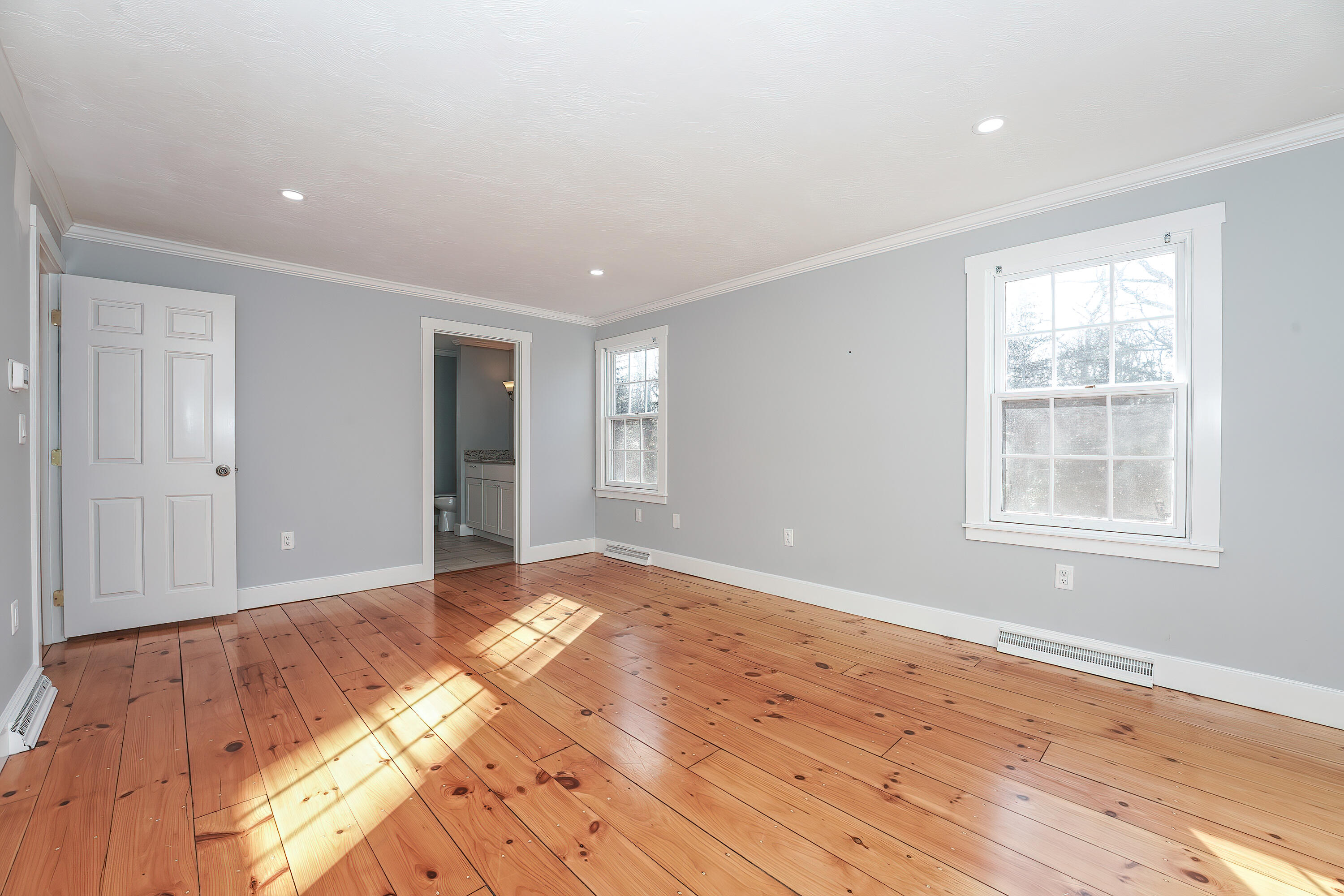 240 Oak Street West Barnstable, MA 02668 - Photo 34 of 89 a view of an empty room with wooden floor and a window