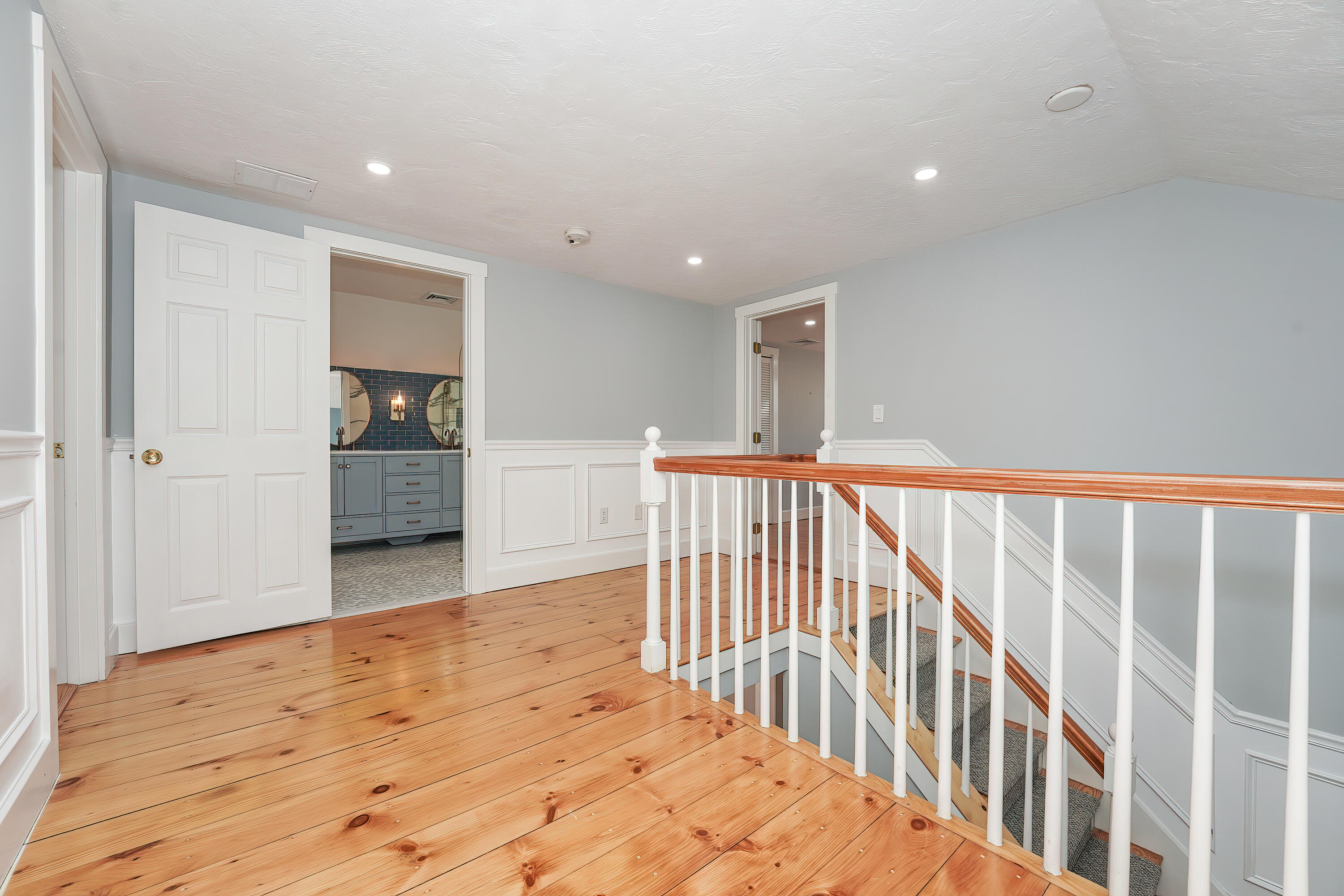 240 Oak Street West Barnstable, MA 02668 - Photo 37 of 89 a view of a hallway with wooden floor and windows
