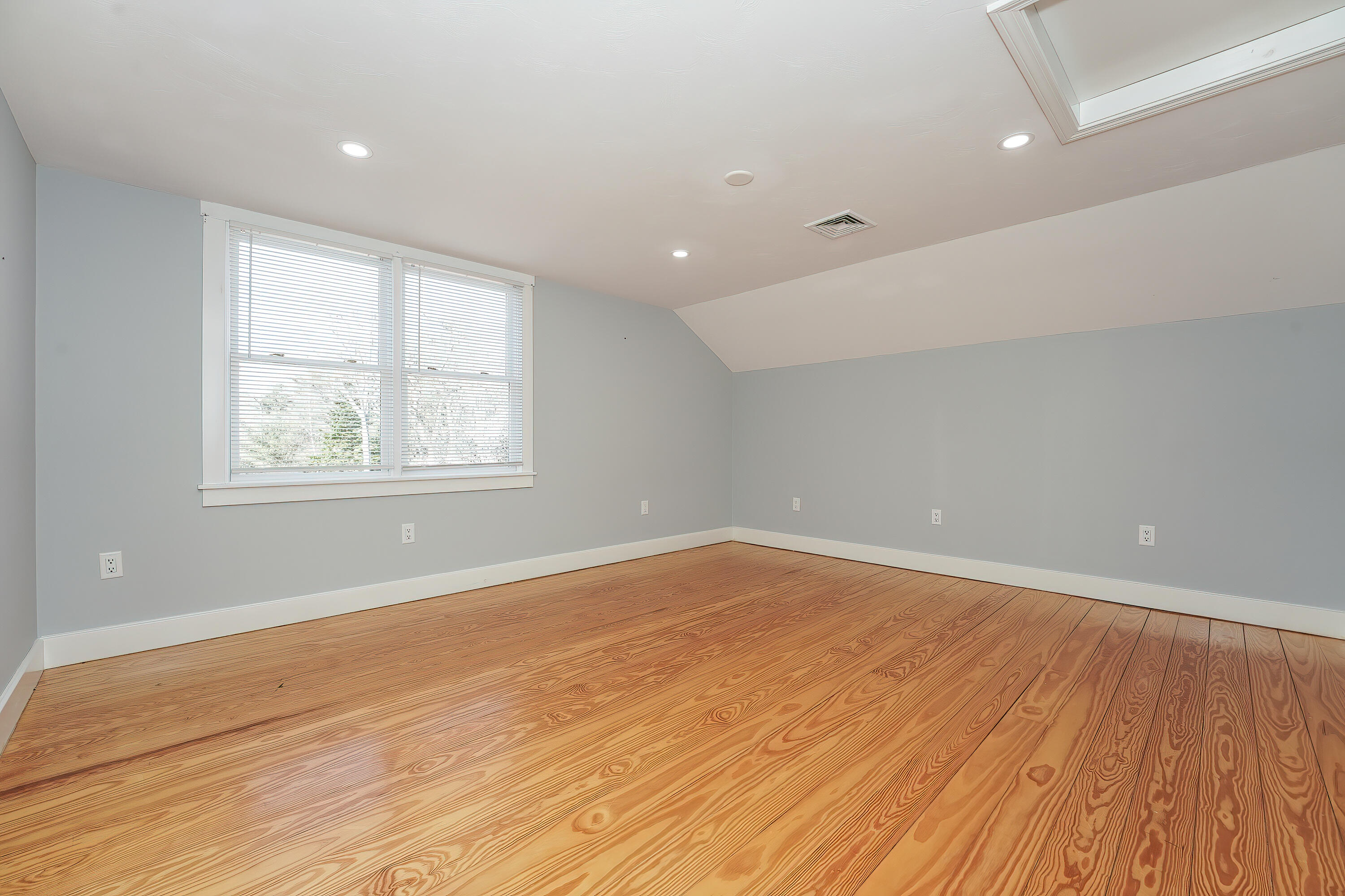 240 Oak Street West Barnstable, MA 02668 - Photo 38 of 89 an empty room with wooden floor and windows
