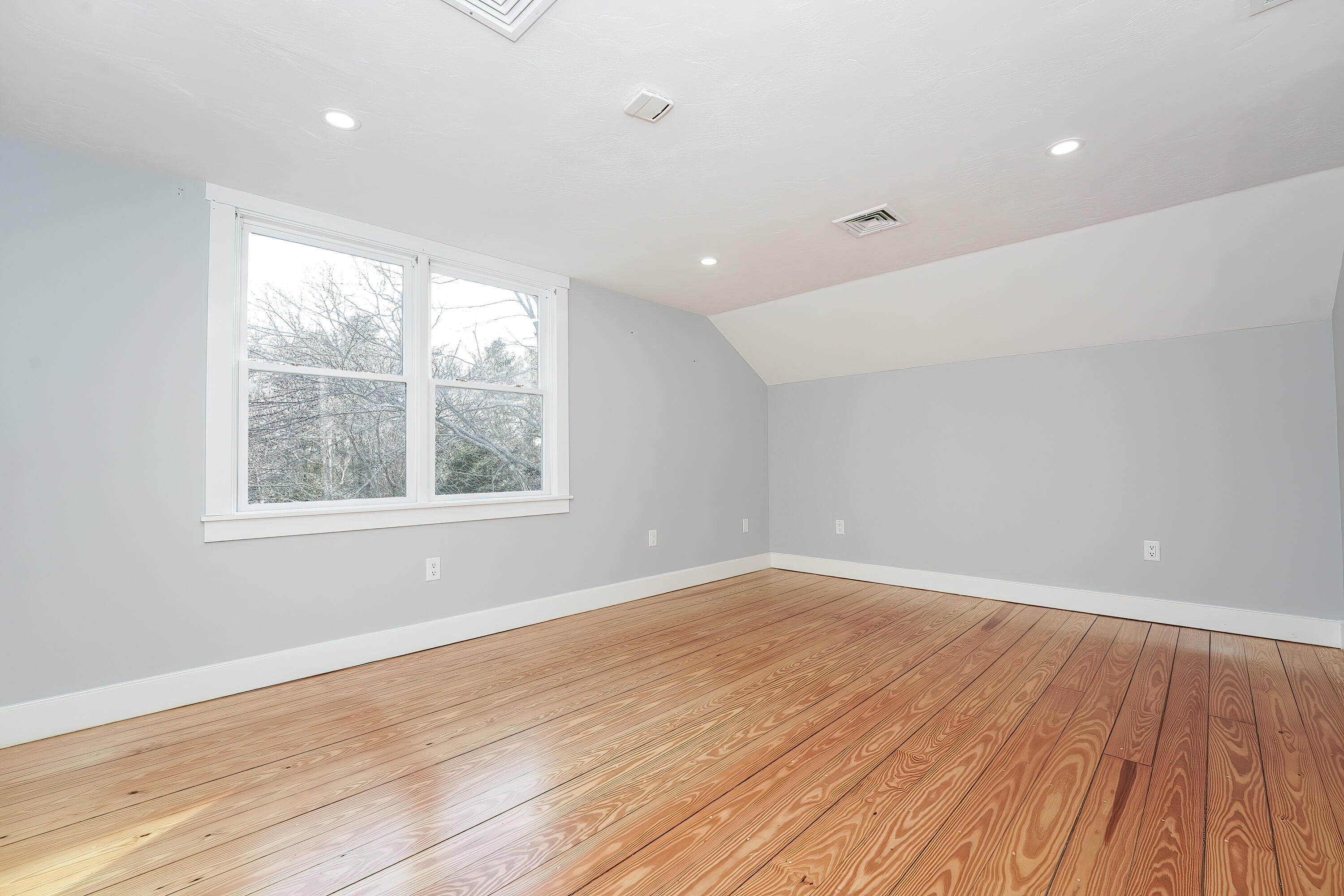240 Oak Street West Barnstable, MA 02668 - Photo 49 of 89 an empty room with wooden floor and windows