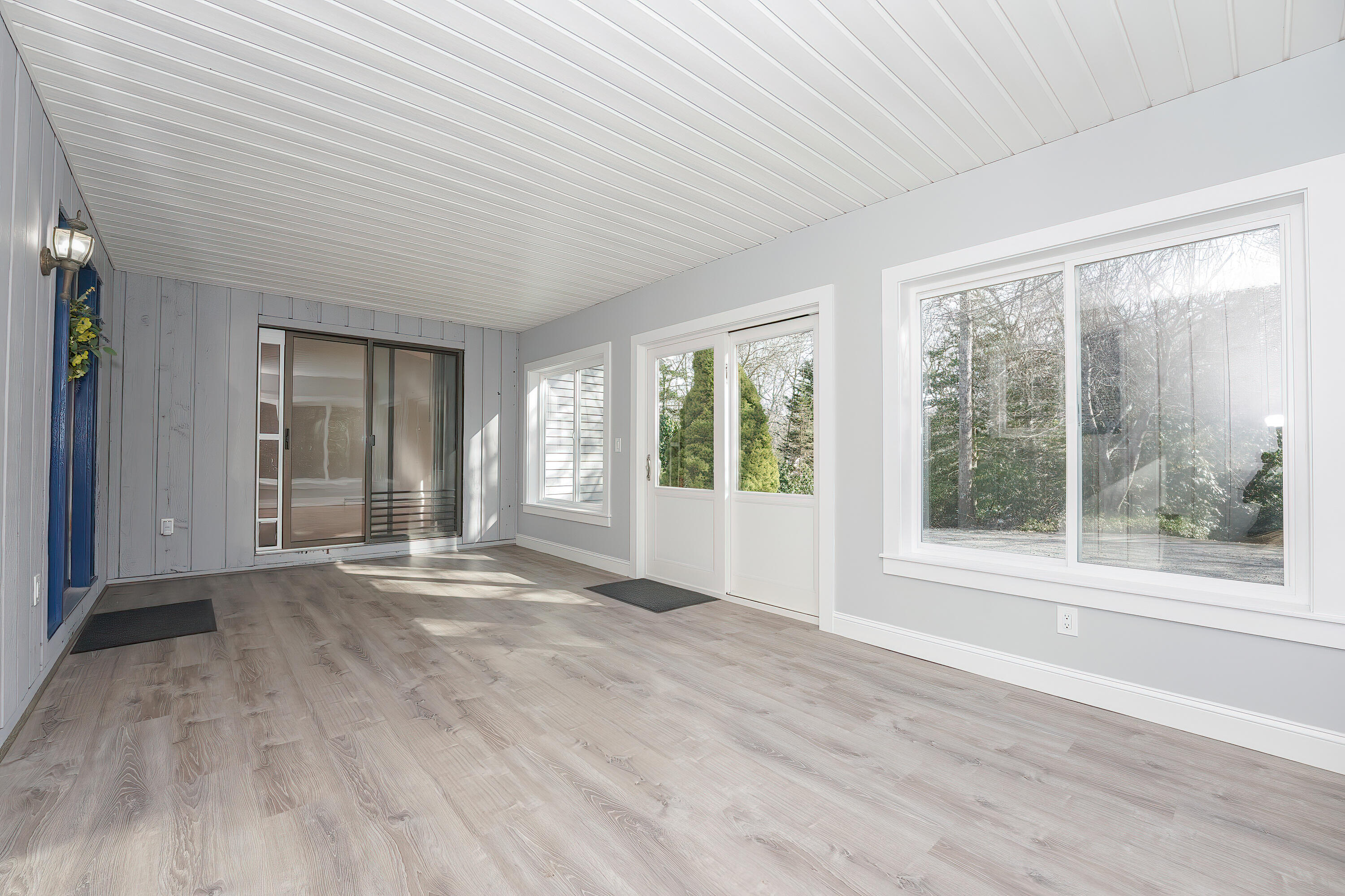240 Oak Street West Barnstable, MA 02668 - Photo 5 of 89 a view of an empty room with wooden floor and a window