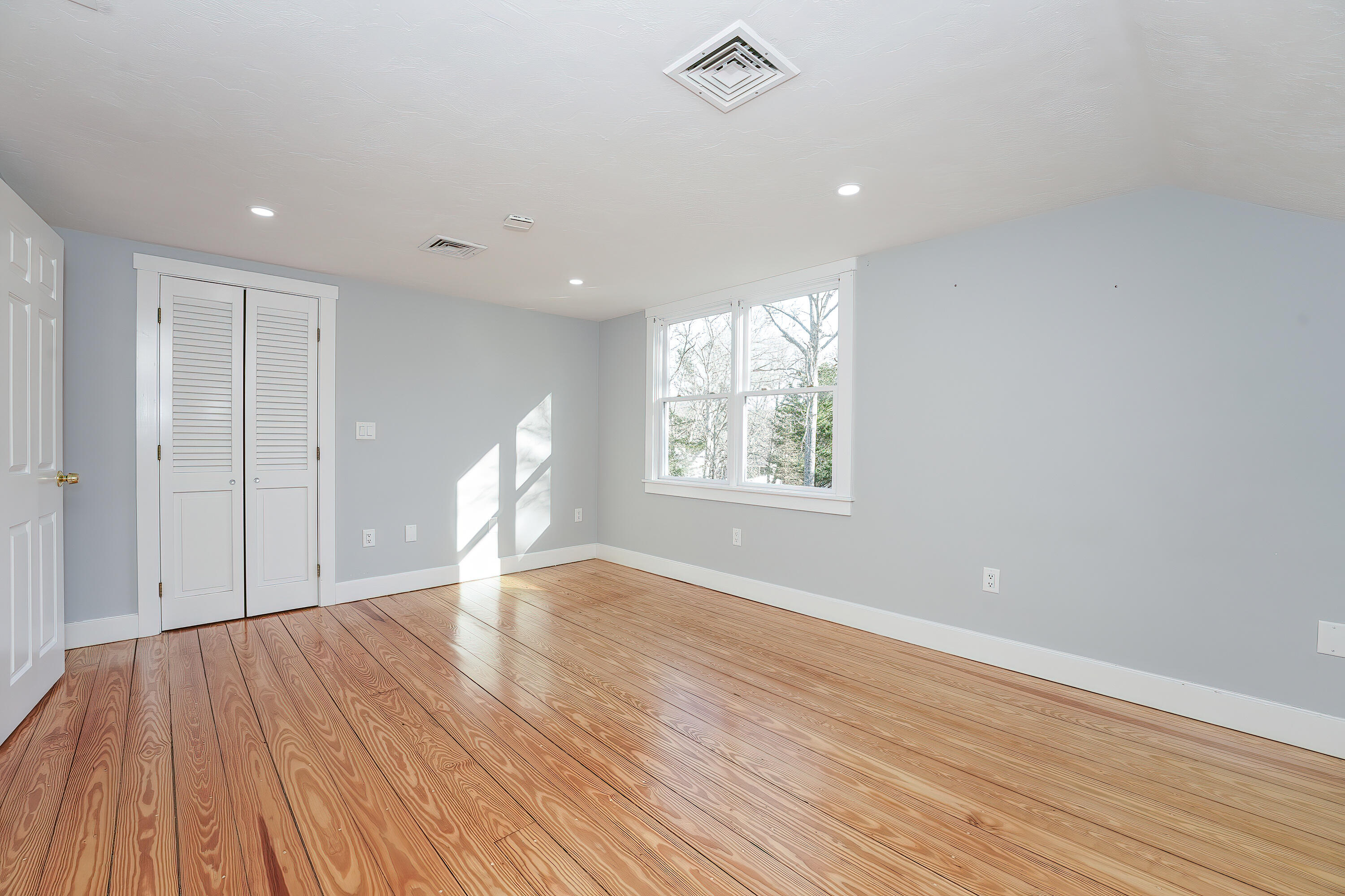 240 Oak Street West Barnstable, MA 02668 - Photo 52 of 89 a view of empty room with wooden floor and fan