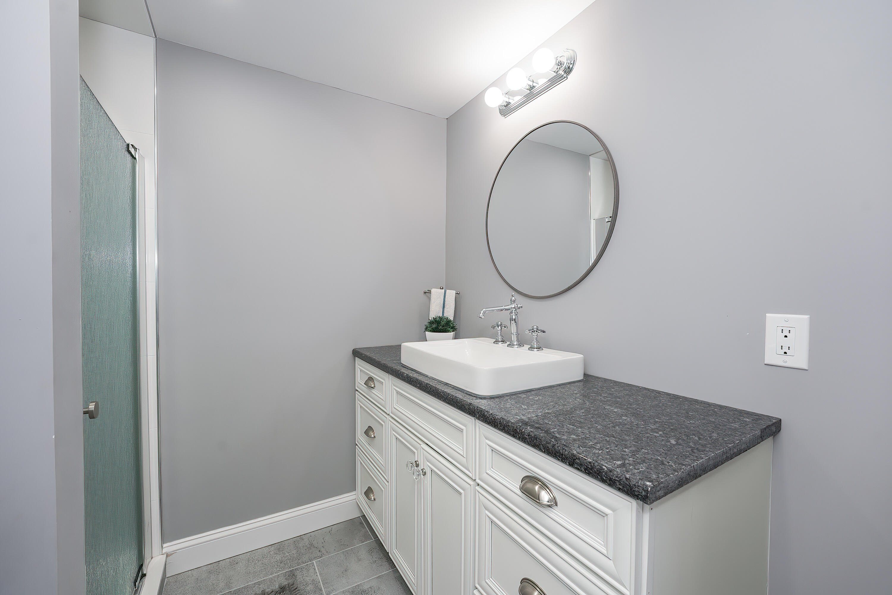 240 Oak Street West Barnstable, MA 02668 - Photo 54 of 89 a bathroom with a granite countertop sink and a mirror