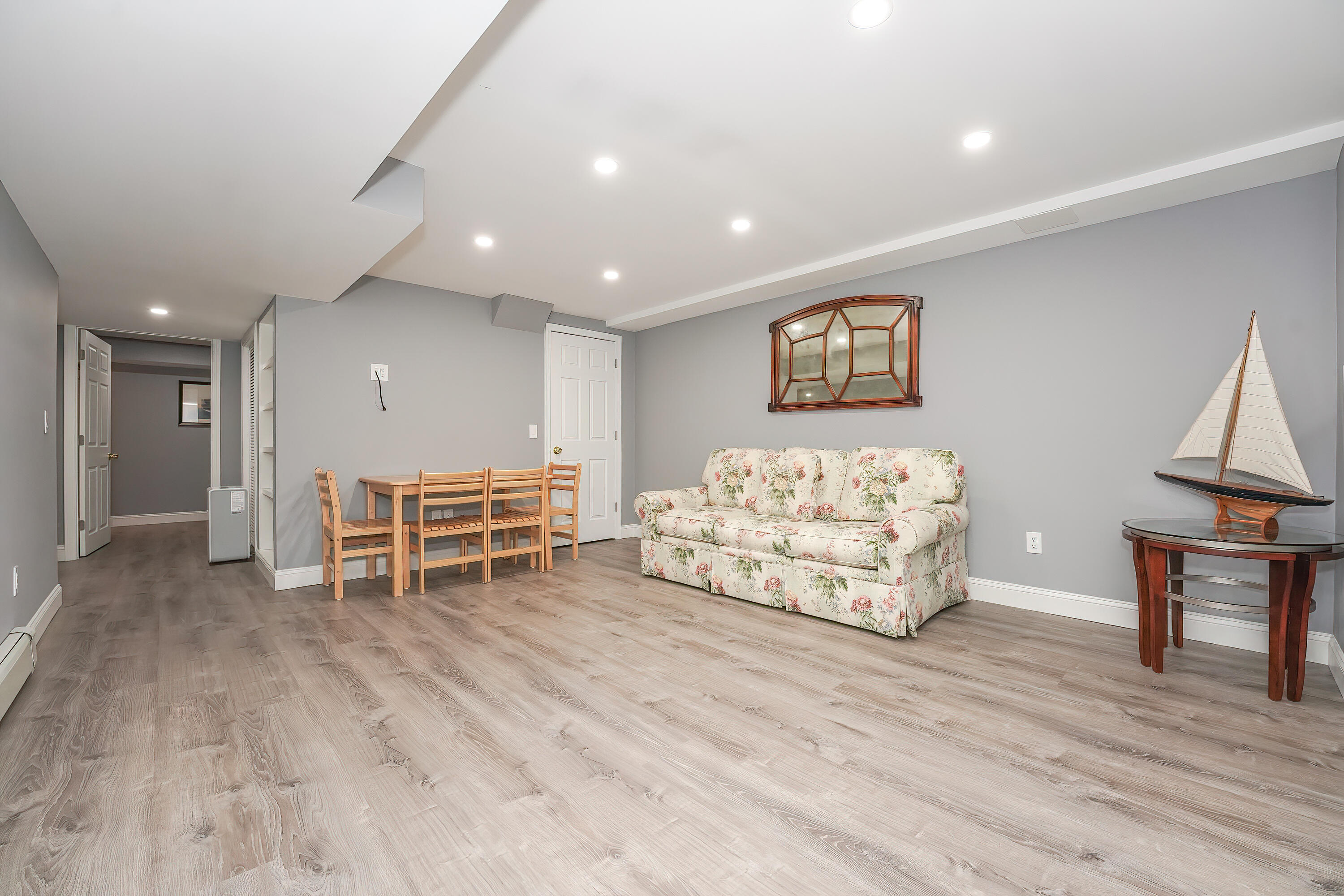 240 Oak Street West Barnstable, MA 02668 - Photo 60 of 89 a spacious bedroom with a bed and a chair