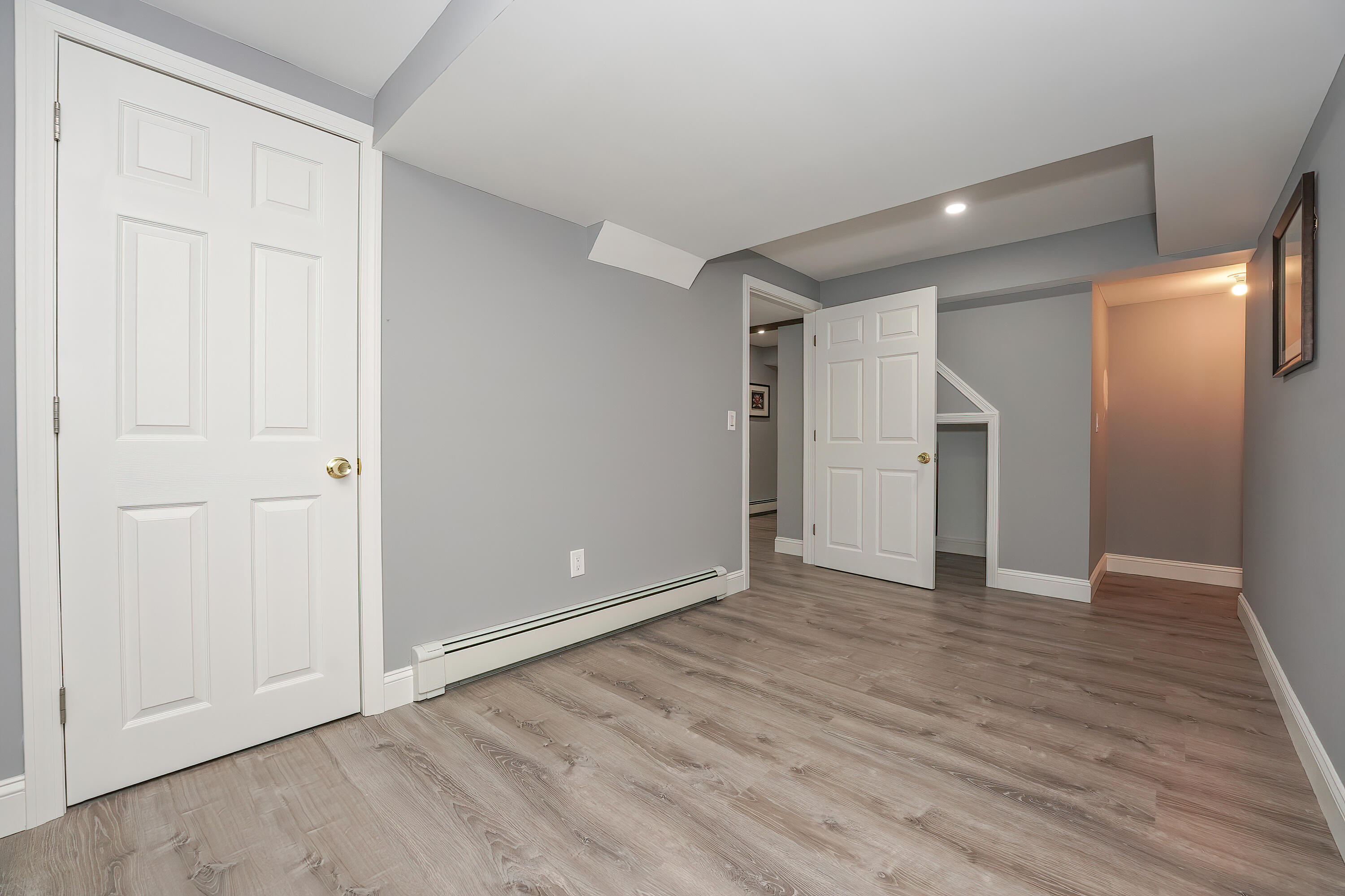 240 Oak Street West Barnstable, MA 02668 - Photo 64 of 89 a view of an empty room with wooden floor