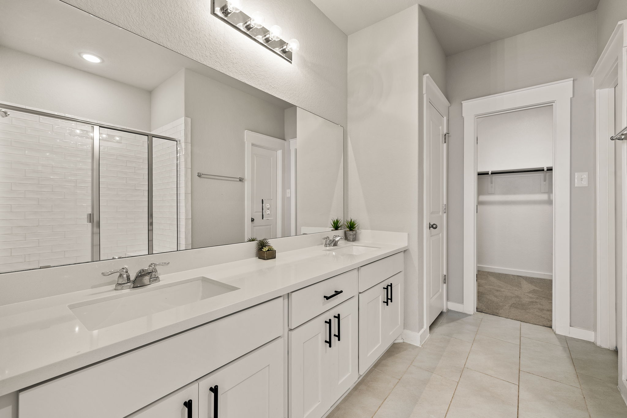 2233 Calvert Drive Leander, TX 78641 - Photo 16 of 32 The ensuite features a dual vanity with quartz counters.