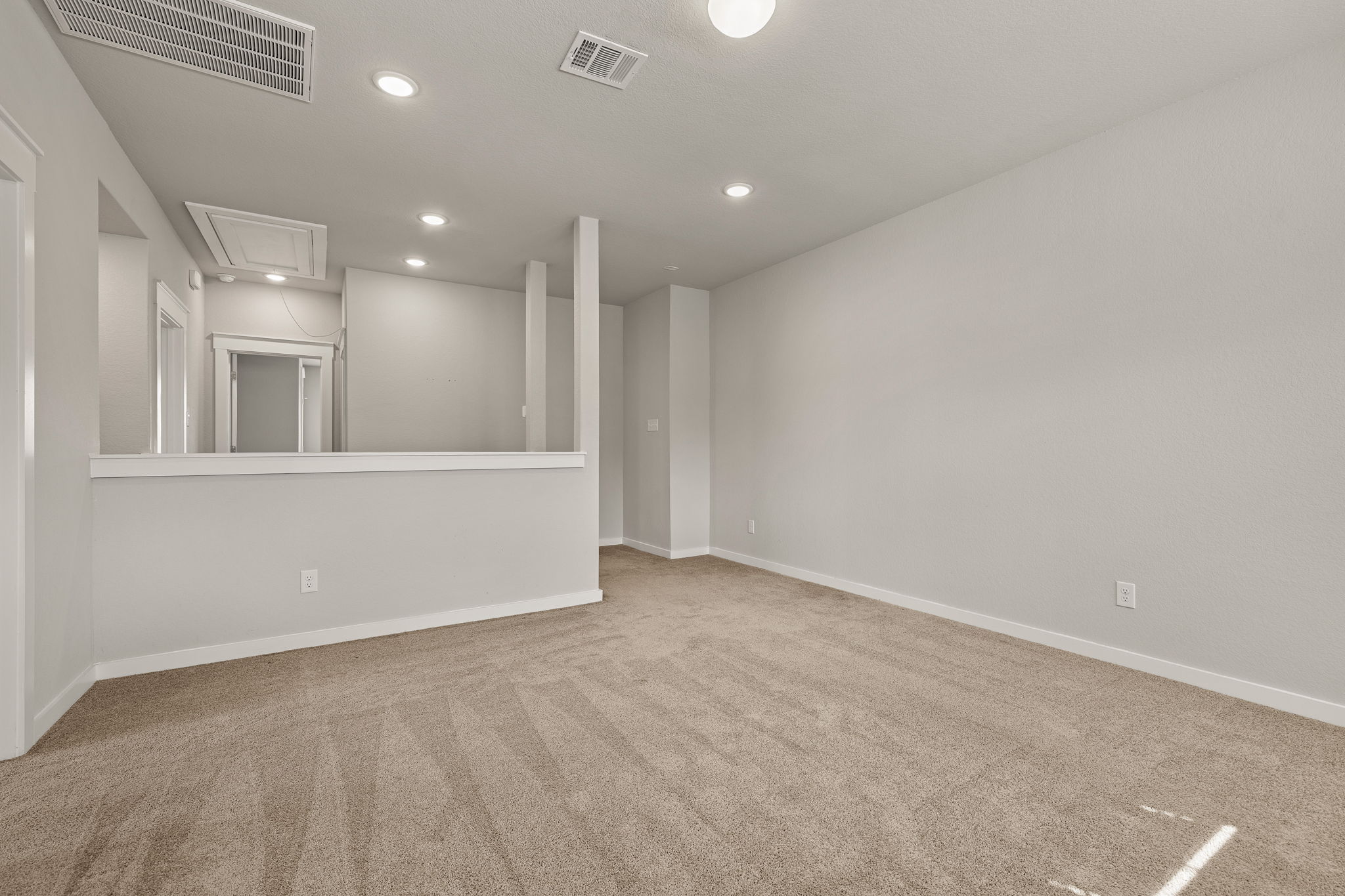 2233 Calvert Drive Leander, TX 78641 - Photo 20 of 32 This space can be utilized for relaxation, a game room, or a playroom, providing comfort and flexibility for everyone upstairs.