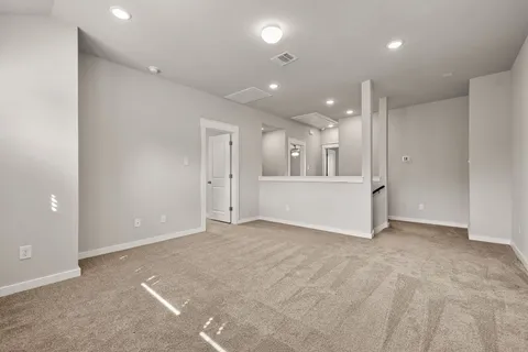 an empty room with white walls and white walls