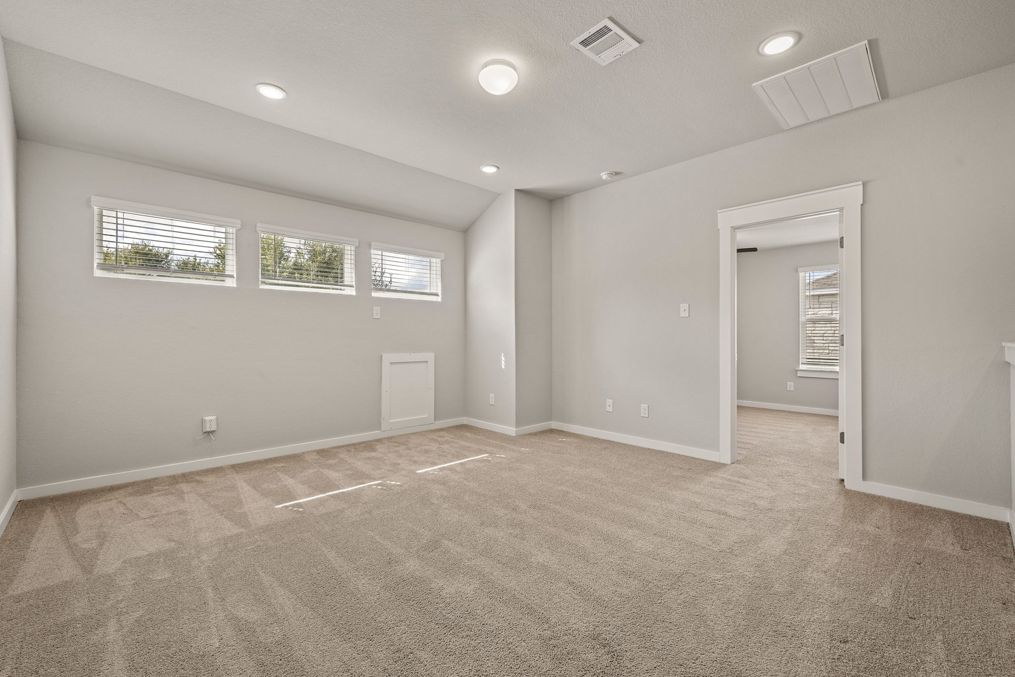 2233 Calvert Drive Leander, TX 78641 - Photo 22 of 32 Windows and recessed lighting brighten the room.
