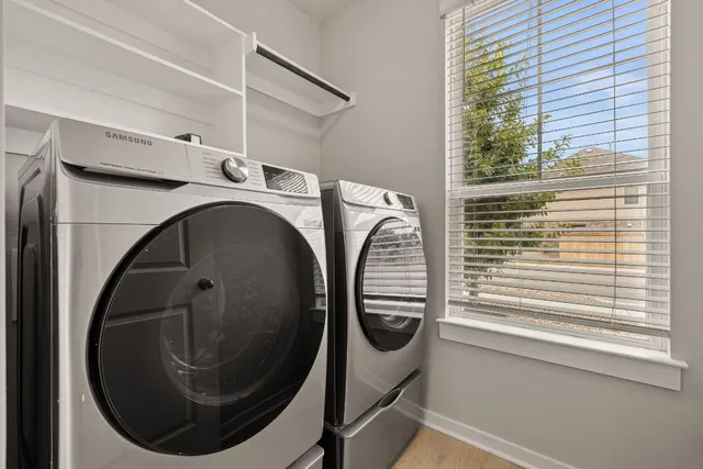 a utility room with dryer and washer