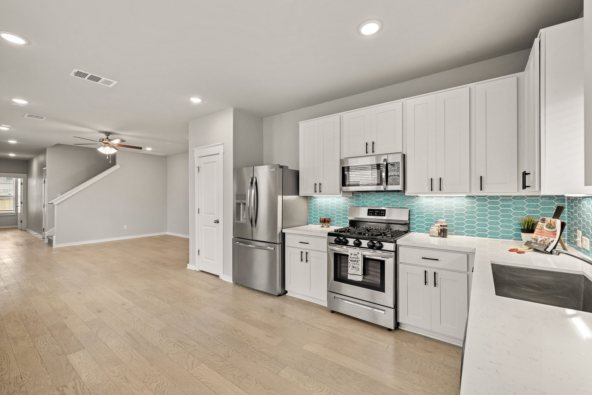 2233 Calvert Drive Leander, TX 78641 - Photo 7 of 32 The stylish backsplash adds a pop of color to the space.