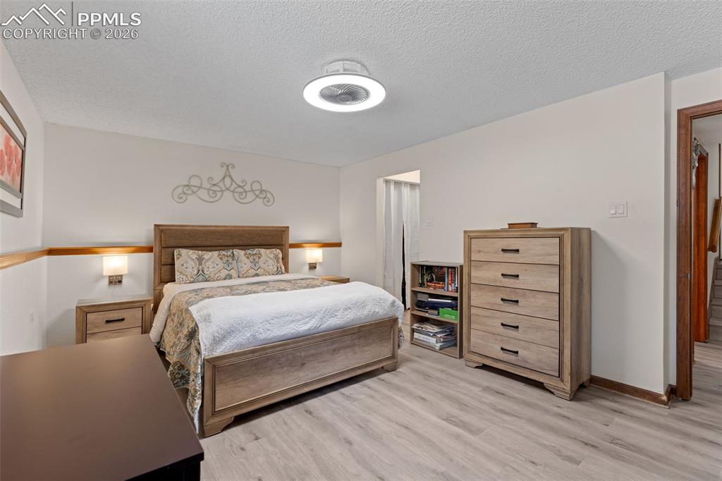 1851 Buttercup Road Elizabeth, CO 80107 - Photo 24 of 47 a bedroom with a bed and a chair