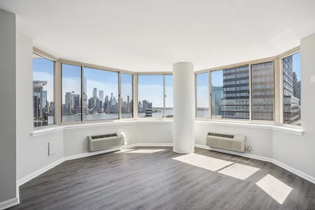 a view of kitchen with closet and wooden floor