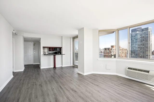 a kitchen with stainless steel appliances granite countertop a sink and a refrigerator