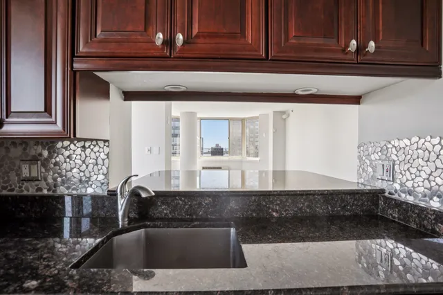 a view of a room with wooden floor and balcony