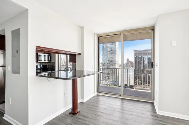 a picture of a hallway with wooden floor