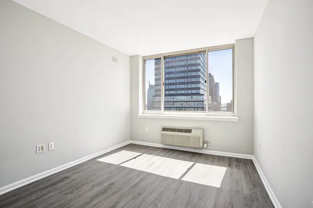 an empty room with wooden floor