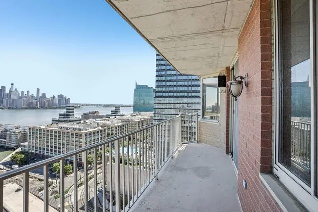 a view of a balcony and city view