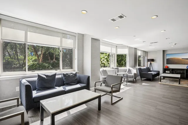 a view of dining room with furniture and wooden floor
