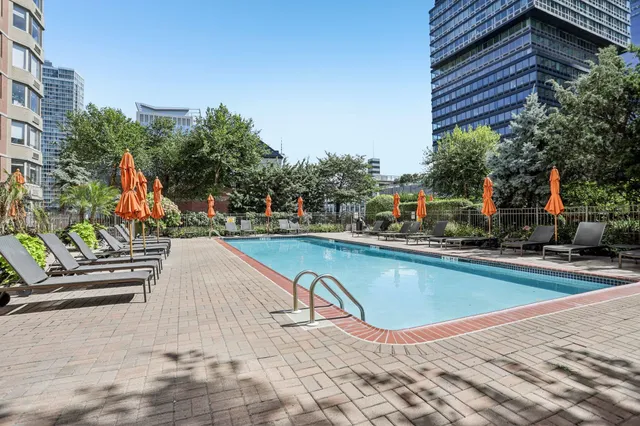 a view of a backyard with sitting area