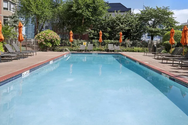 a view of a swimming pool with a lounge chairs