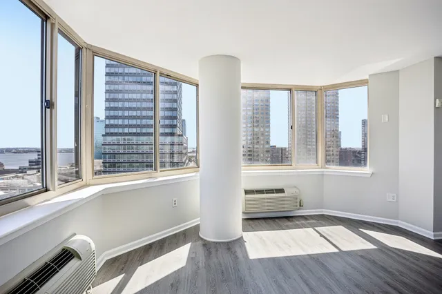 a view of an empty room with a window