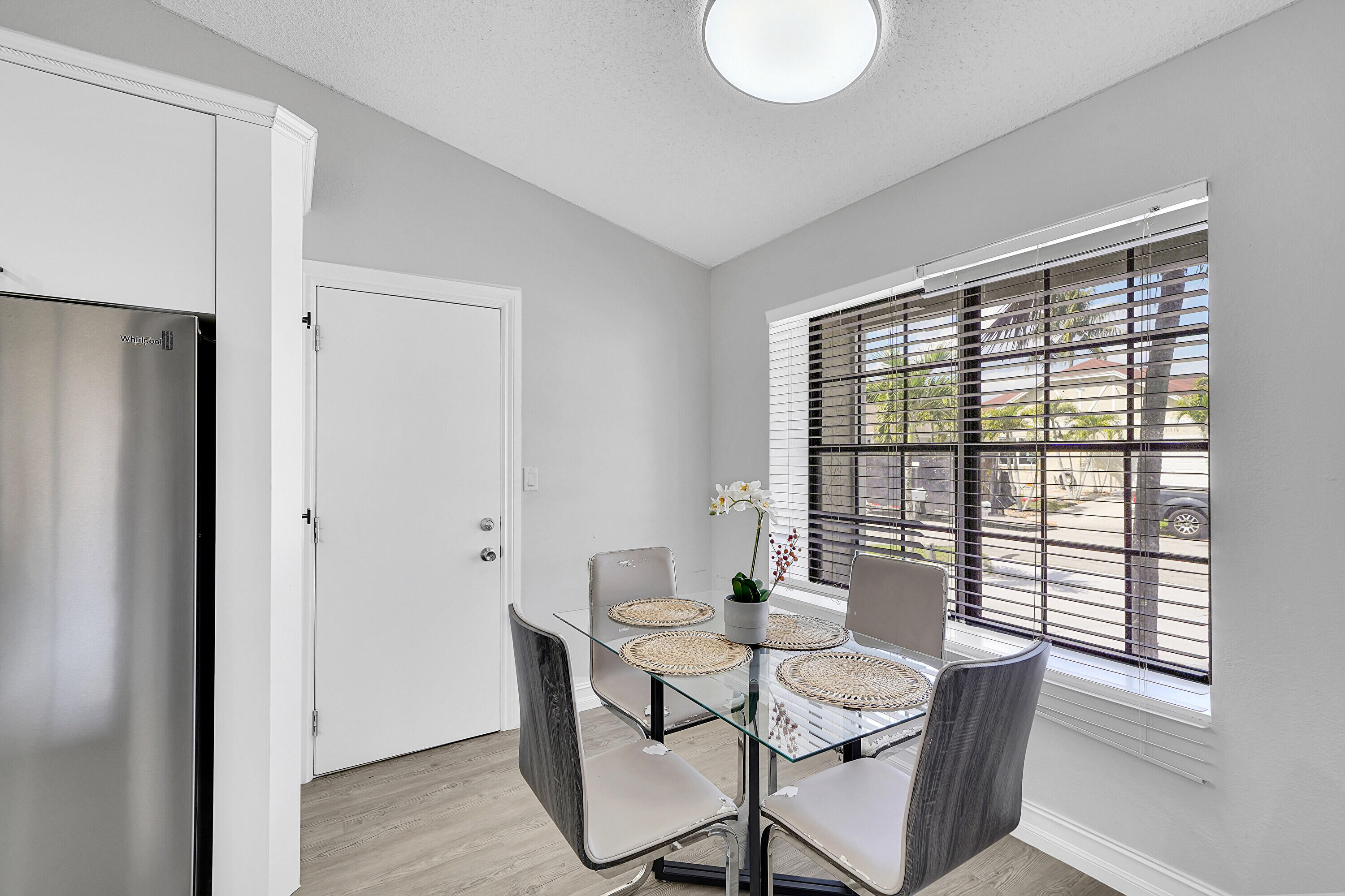 11120 North Terradas Lane Boca Raton, FL 33428 - Photo 13 of 57 a view of a dining room with furniture and wooden floor