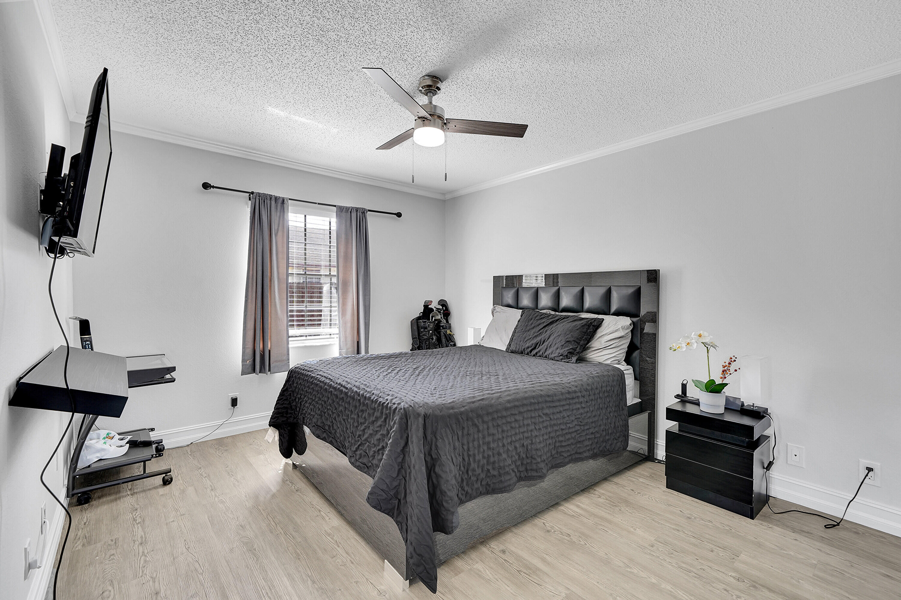 11120 North Terradas Lane Boca Raton, FL 33428 - Photo 18 of 57 a bedroom with a bed and wooden floor