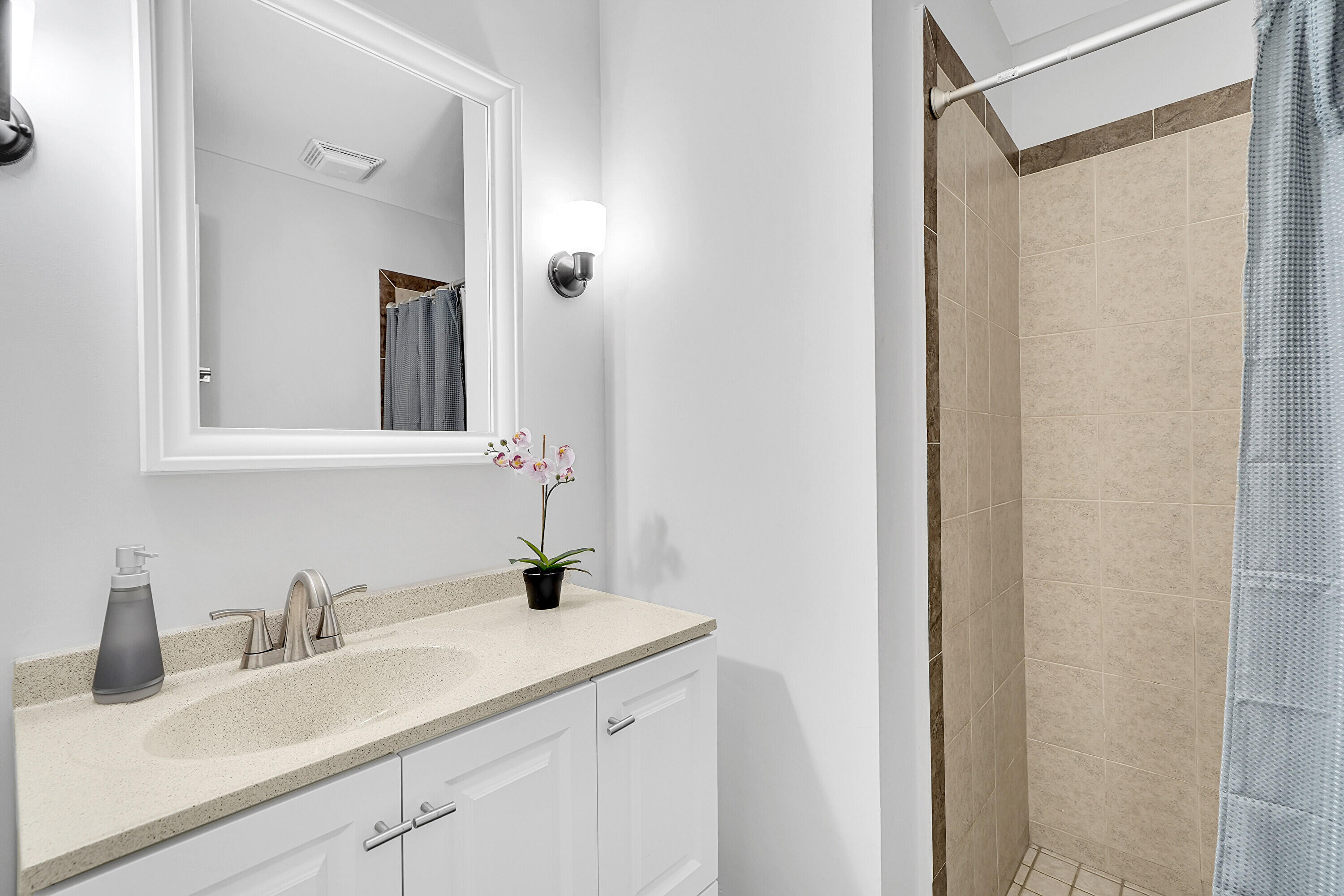 11120 North Terradas Lane Boca Raton, FL 33428 - Photo 21 of 57 a bathroom with a sink and a mirror