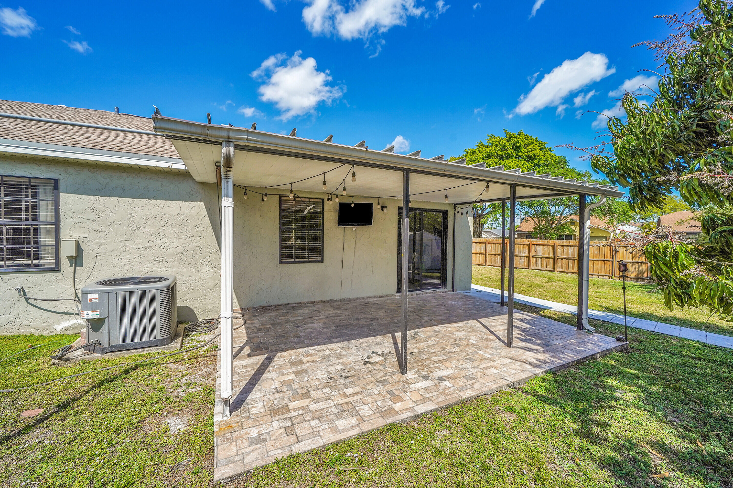 11120 North Terradas Lane Boca Raton, FL 33428 - Photo 32 of 57 a front view of a house with garden