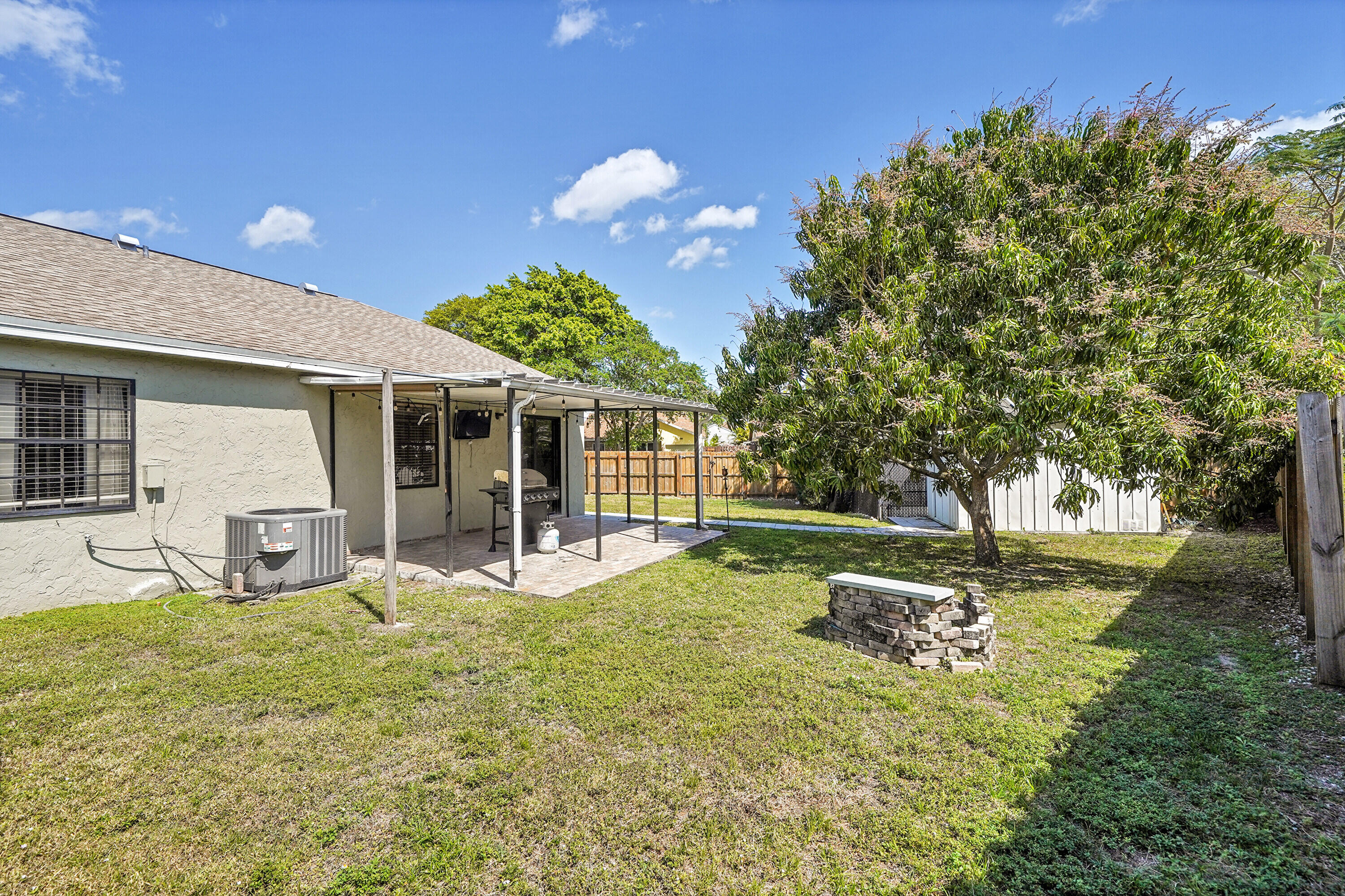 11120 North Terradas Lane Boca Raton, FL 33428 - Photo 37 of 57 a view of a house with backyard and sitting area