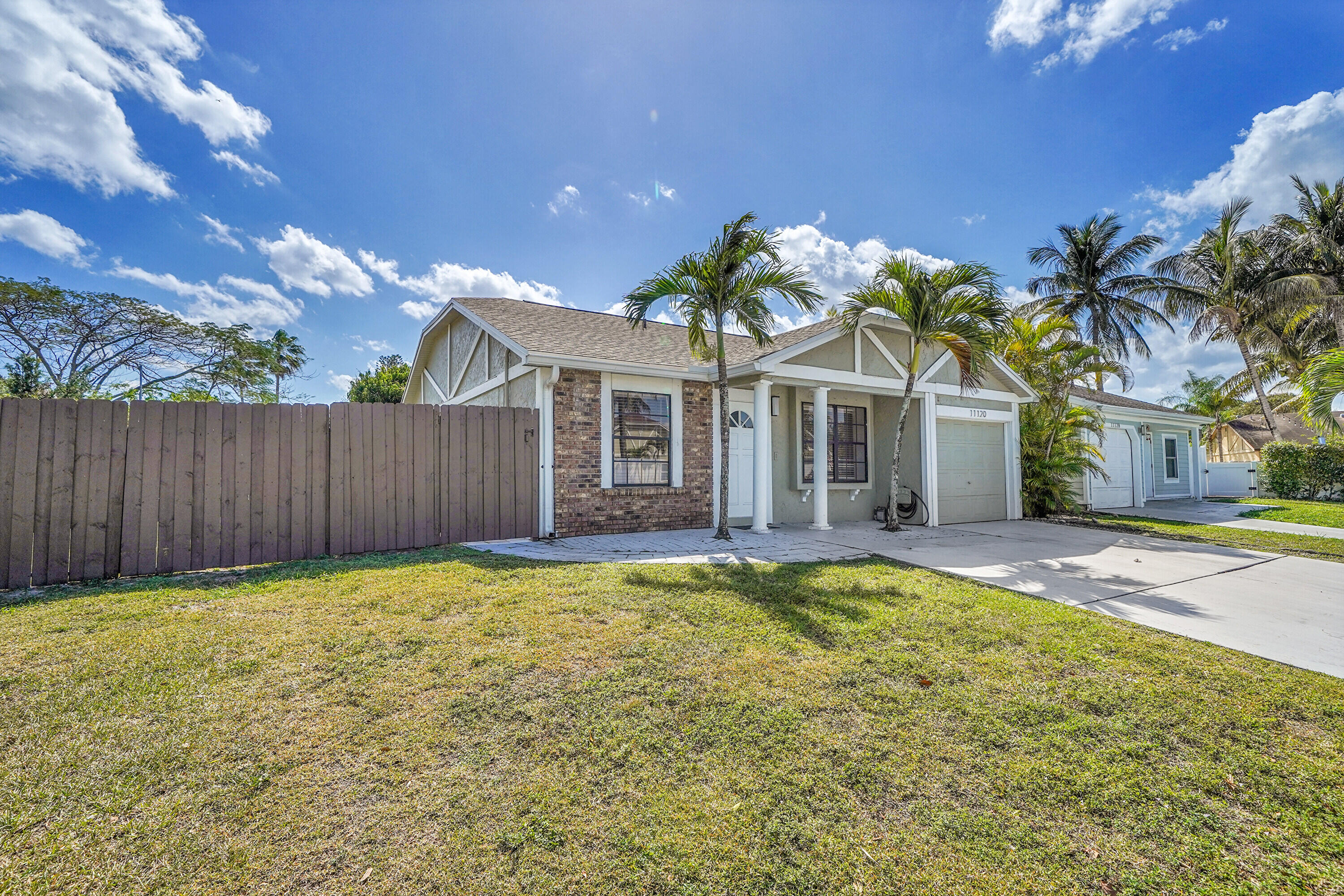 11120 North Terradas Lane Boca Raton, FL 33428 - Photo 5 of 57 a view of a house with a swimming pool