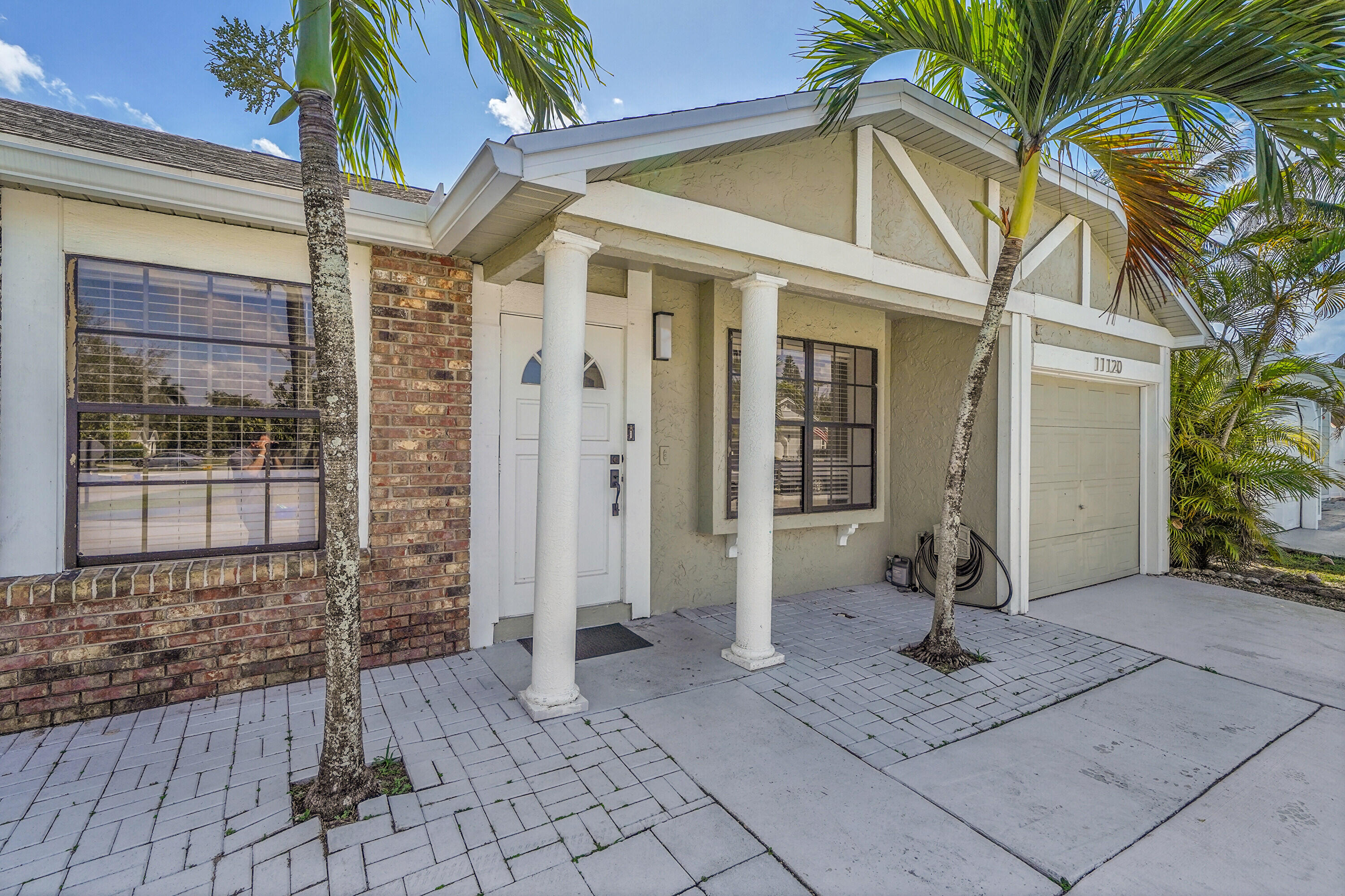 11120 North Terradas Lane Boca Raton, FL 33428 - Photo 7 of 57 a front view of a house